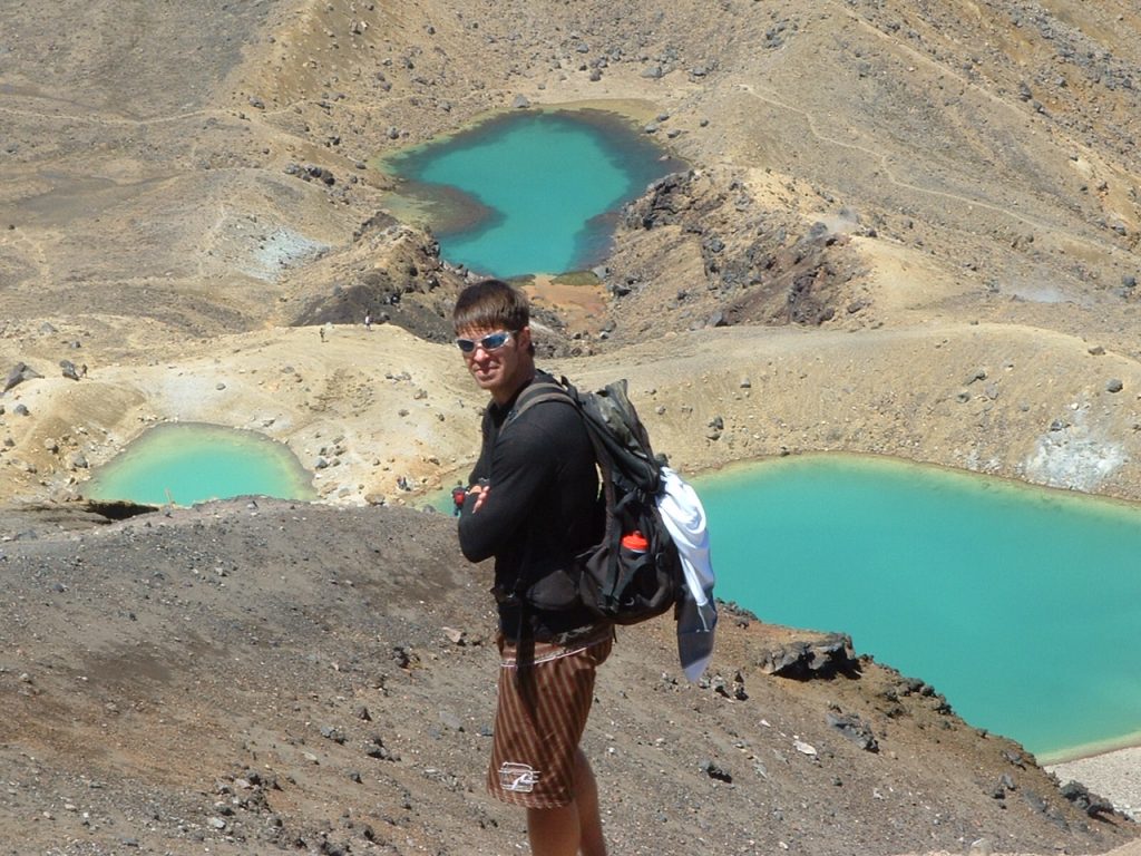 Picture of Travis Taylor, registered nurse, hiking. Lakes in background.